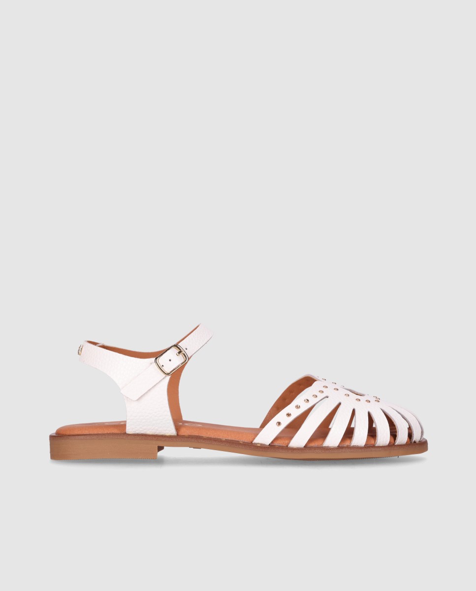 Imagen 0 de Sandalia plana de mujer en piel con tiras troqueladas estilo cangrejera y pulsera Blanco