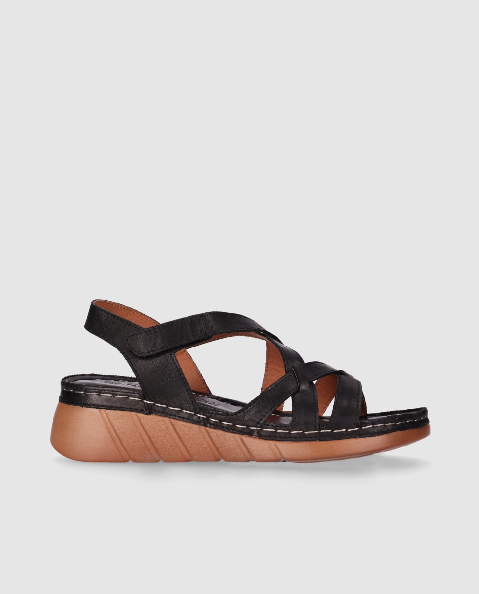 Imagen 0 de Sandalias de cuña baja de mujer con tiras cruzadas en piel y cierre ajustable Negro