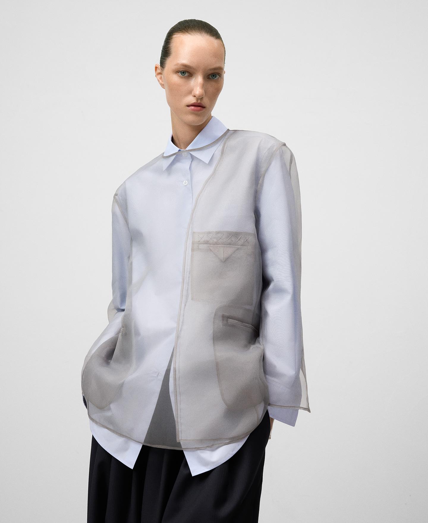 Top de mujer transparente con piezas de blazer