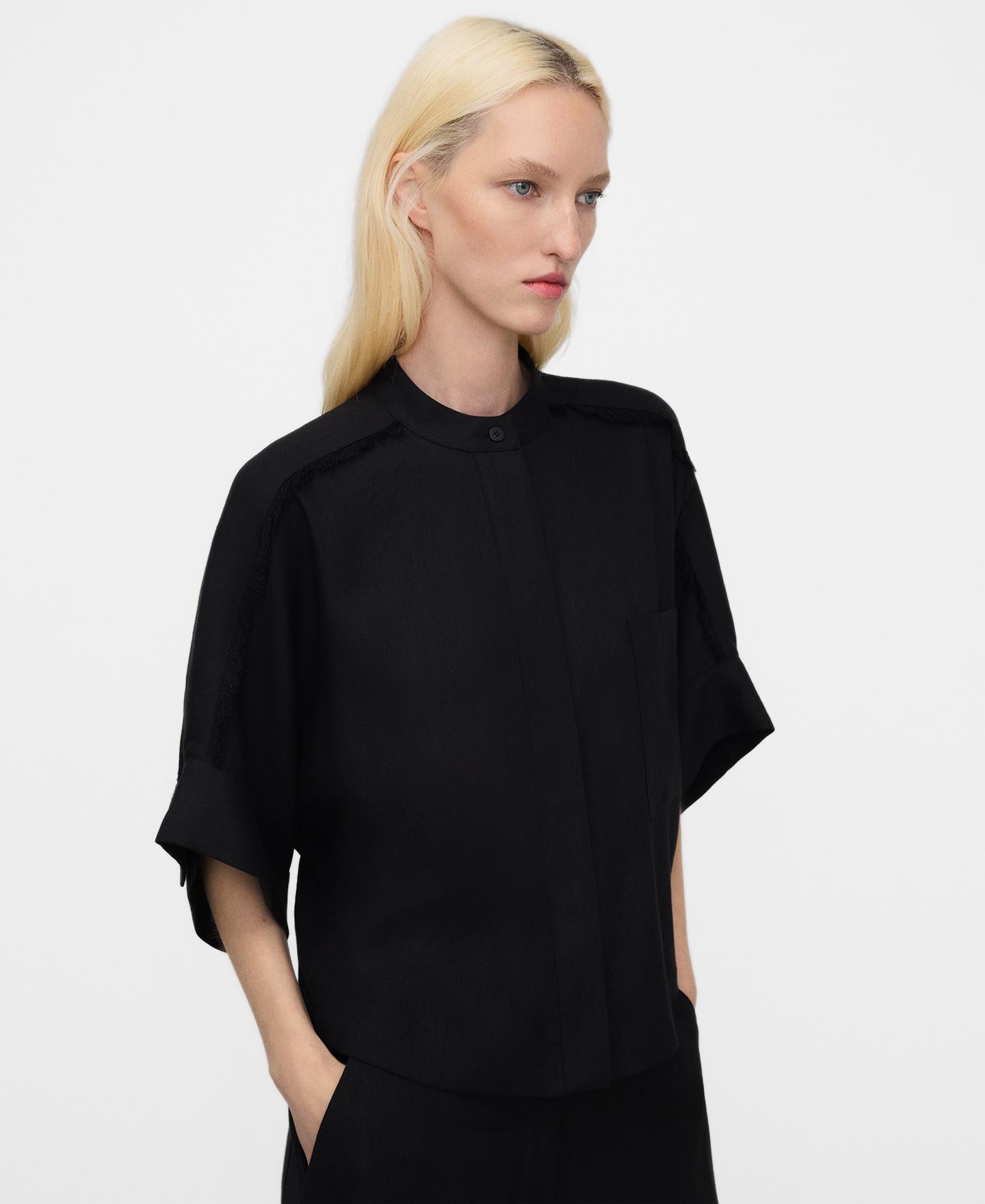 Adolfo Dominguez - Camisa de mujer oversize desflecada.