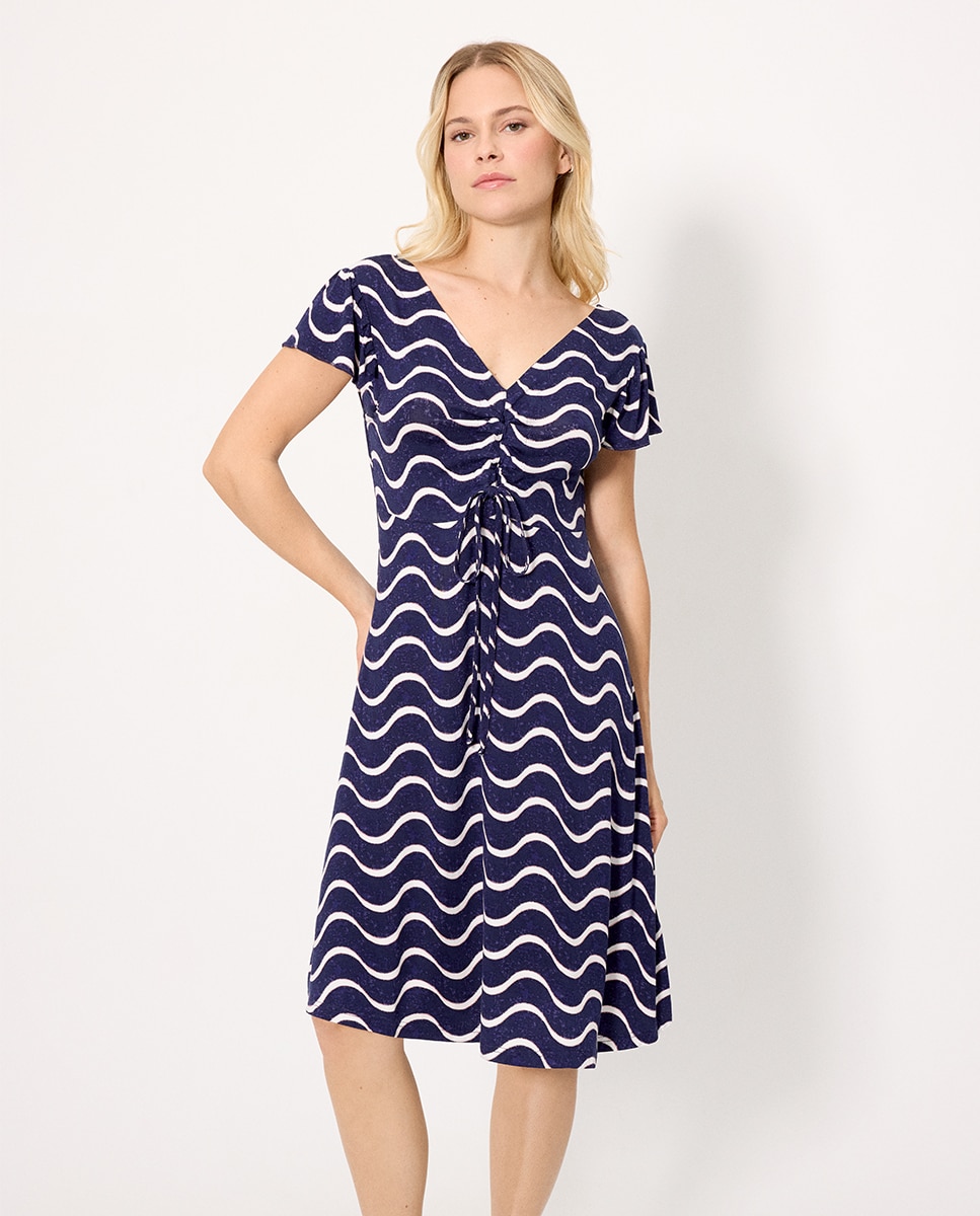 Ysabel Mora - Vestidos de playa manga corta estampado ondas.
