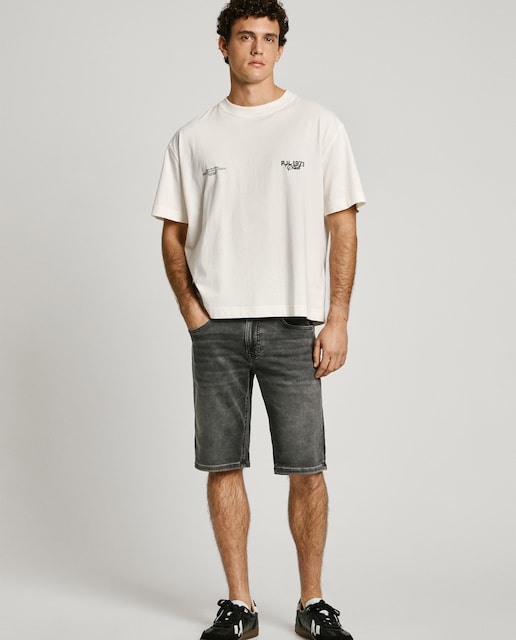 Bermuda vaquera de hombre fit slim con efecto desgastado