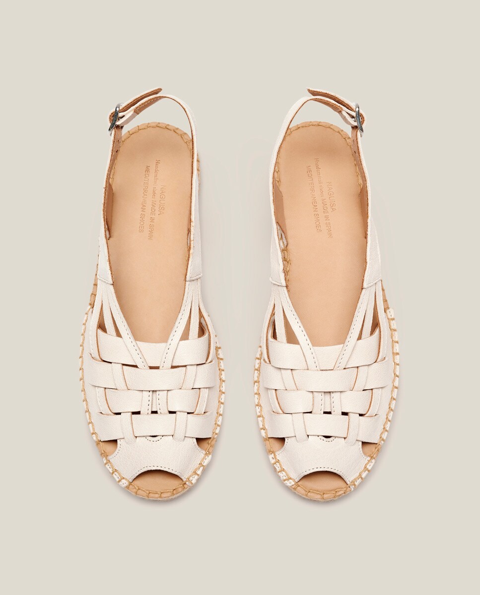 Alpargatas planas de mujer de tiras de piel pasadas · Naguisa · El