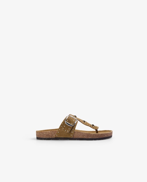 Imagen 0 de Sandalias planas de mujer de piel con detalles metálicos