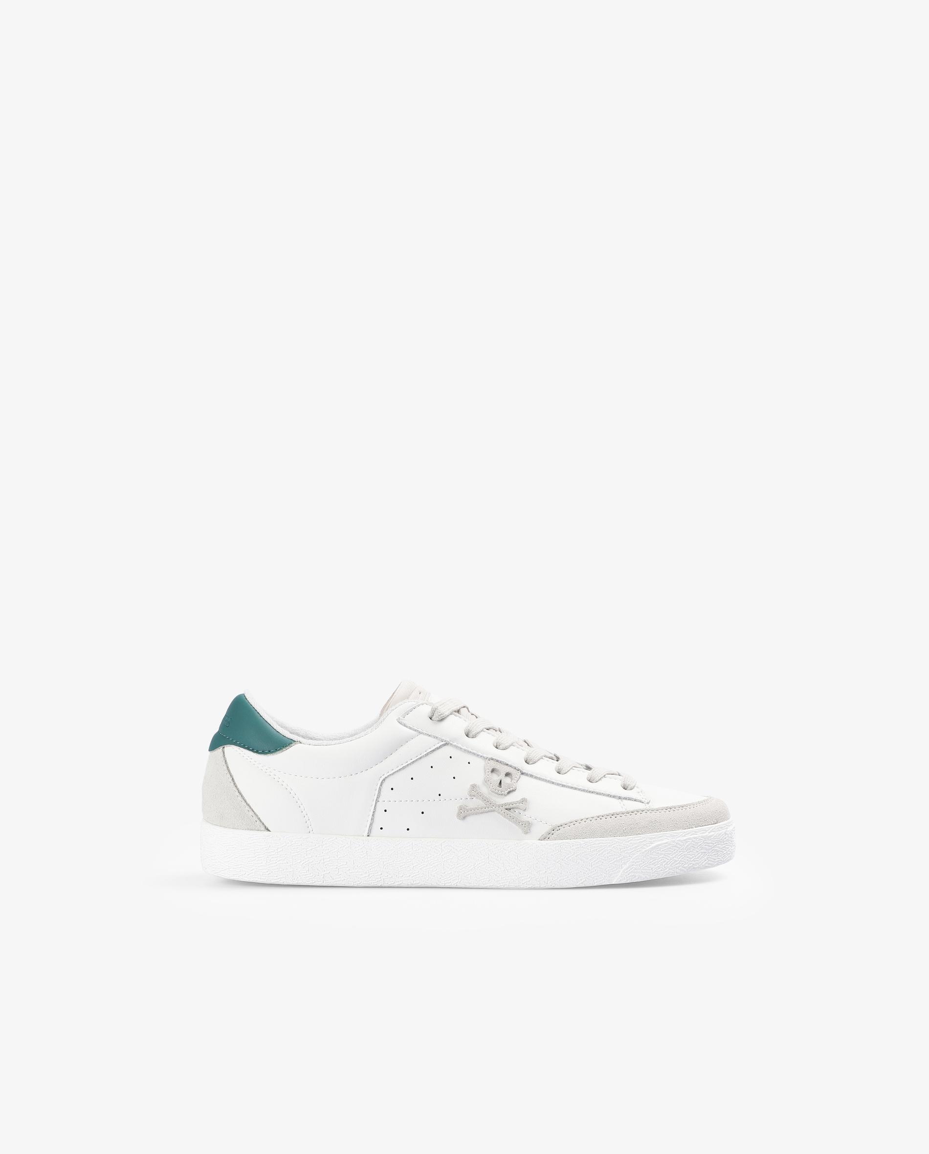 Scalpers - Sneakers bajas calavera contraste.