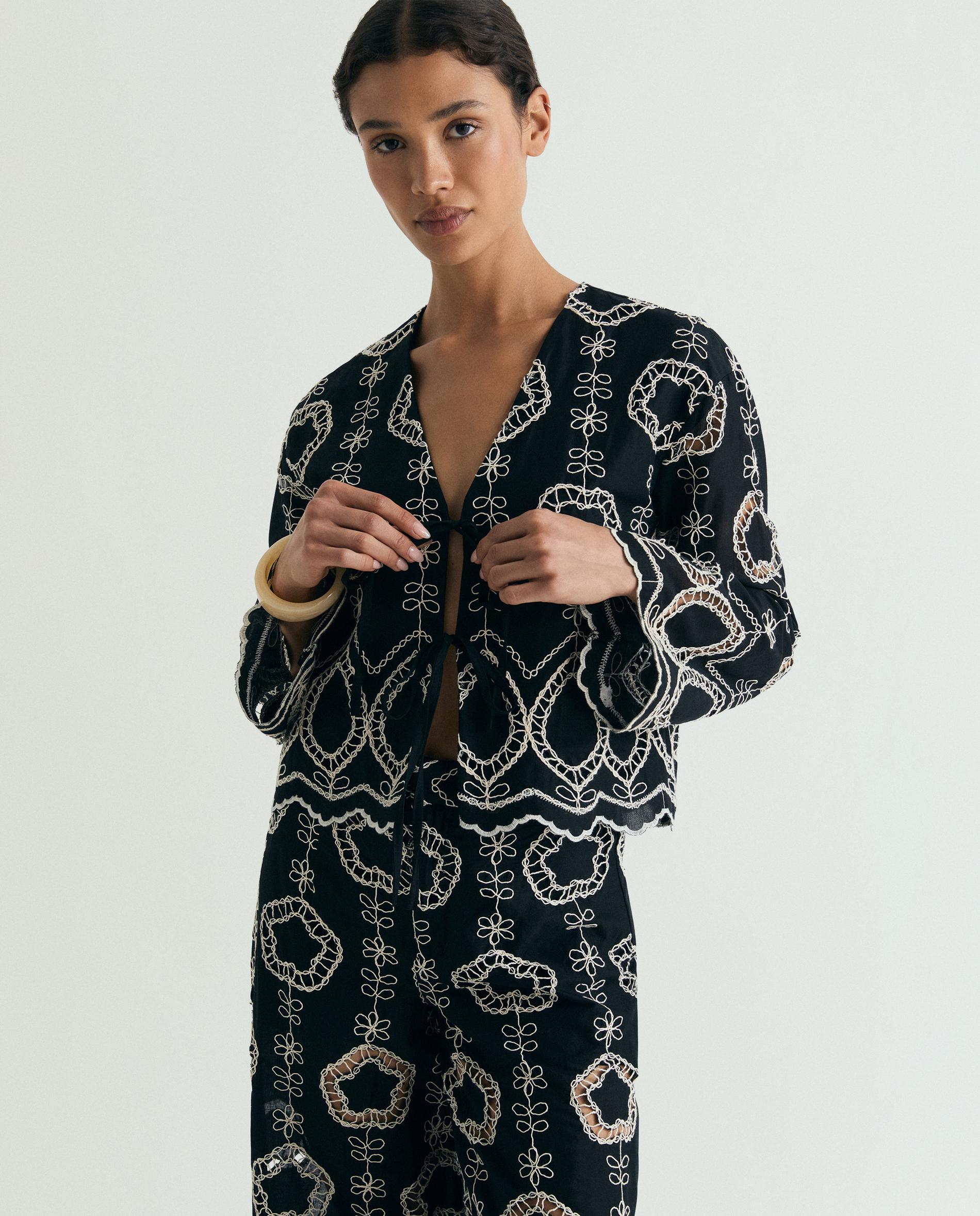 Scalpers - Camisa de mujer bordada con escote de pico.