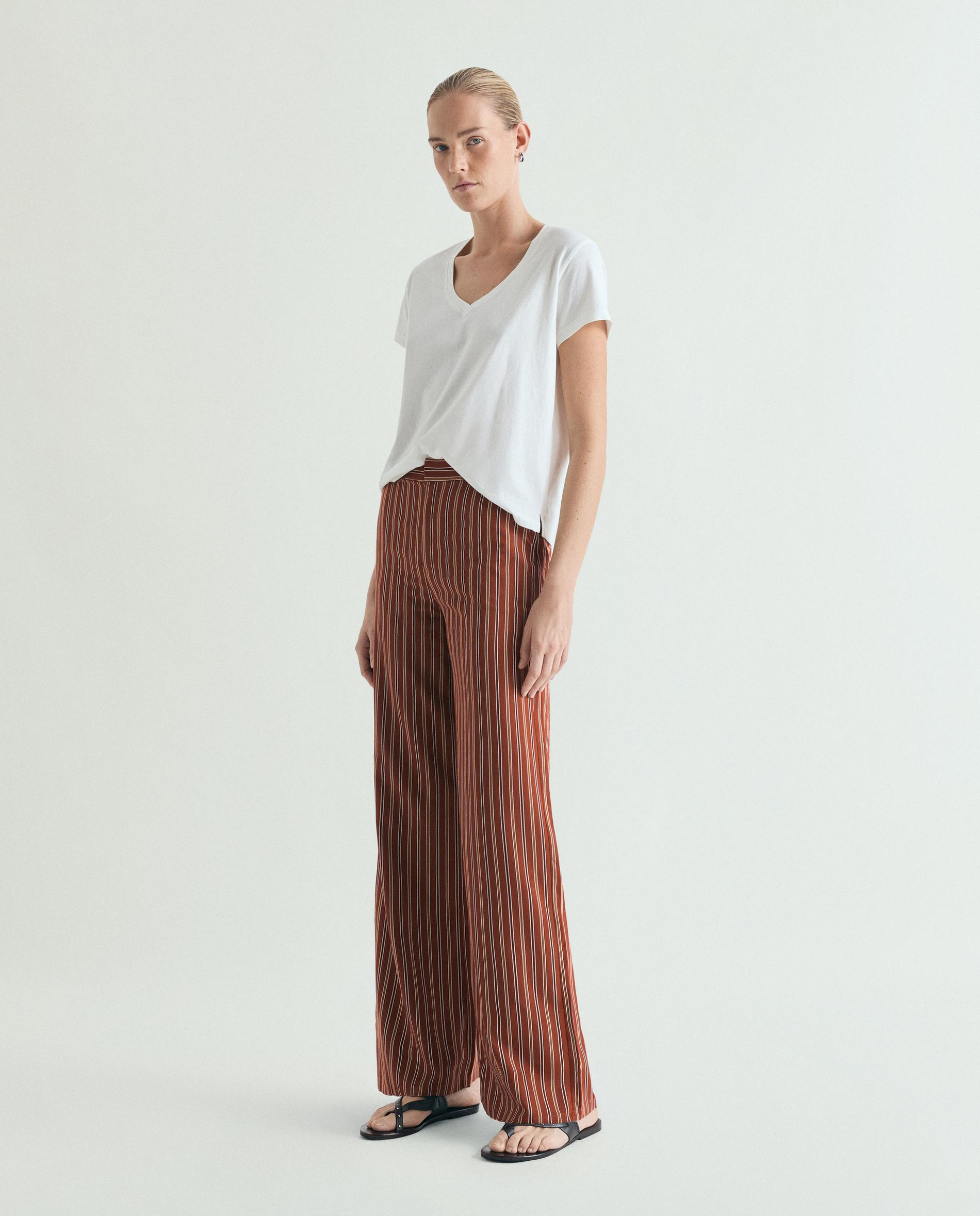 Scalpers - Pantalón recto de mujer en tejido fluido de rayas.