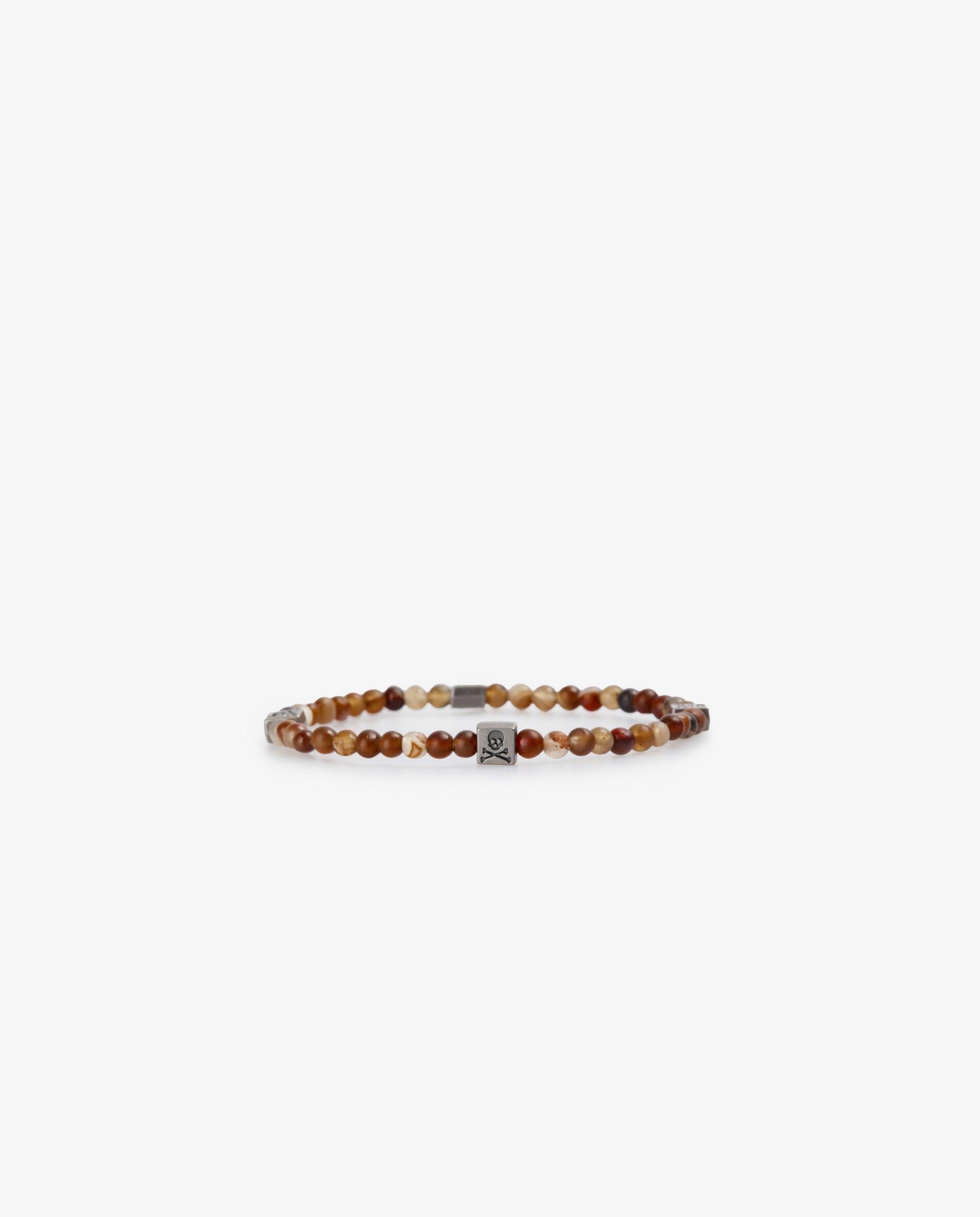 Imagen 0 de Pulsera de hombre elástica de cuentas mini con detalles metálicos Marrón