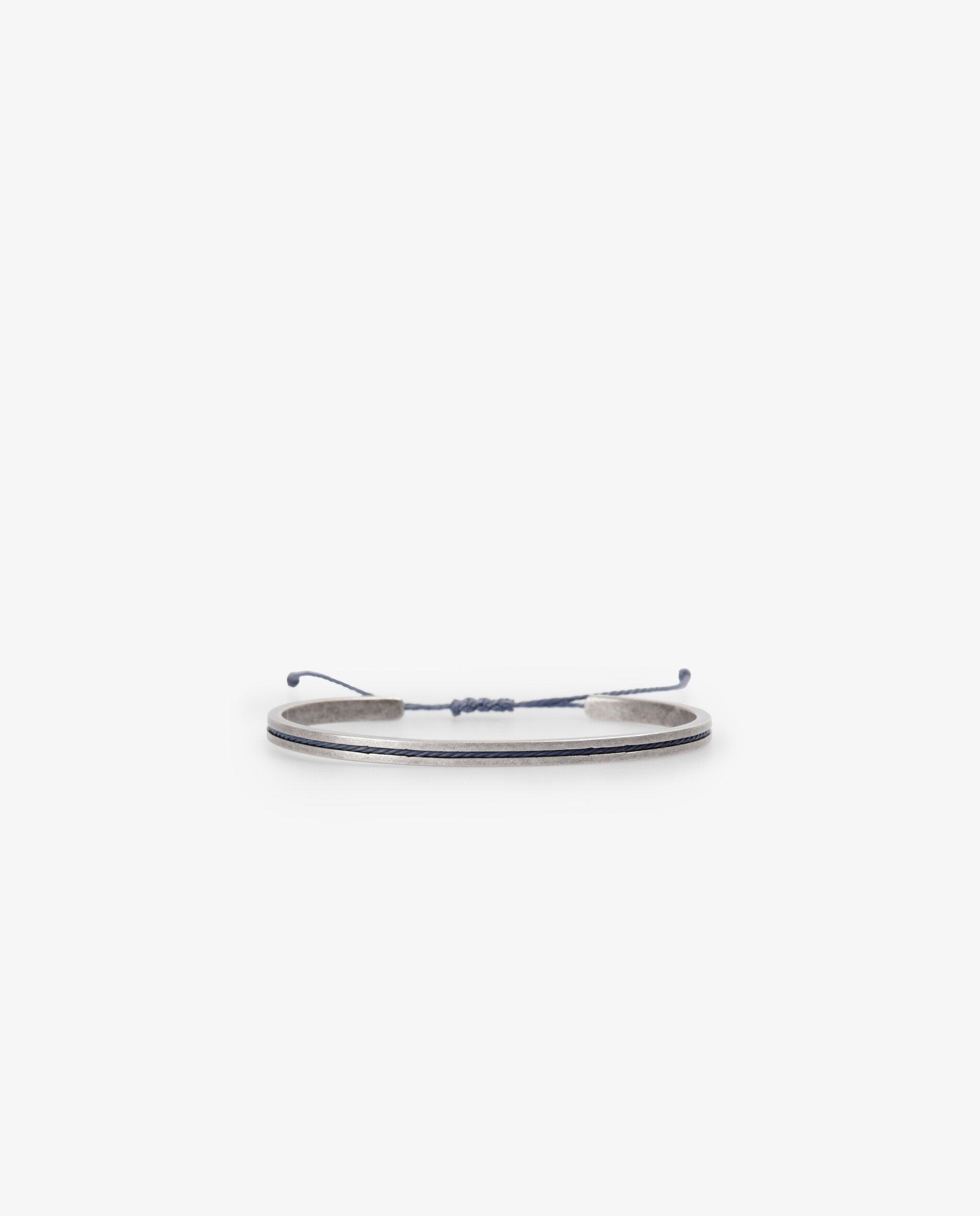 Imagen 0 de Pulsera de hombre metálica con cordón ajustable Plata