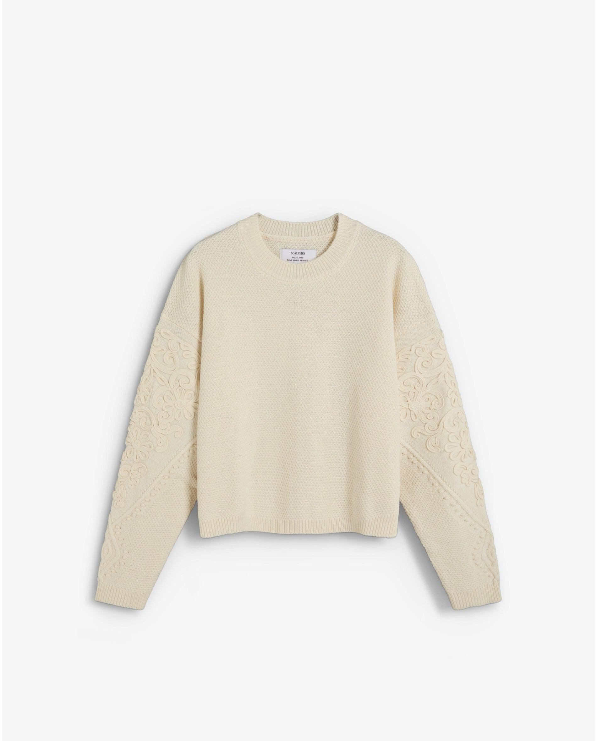 Imagen 1 de Jersey de mujer con cuello redondo y motivos florales en las mangas Beige