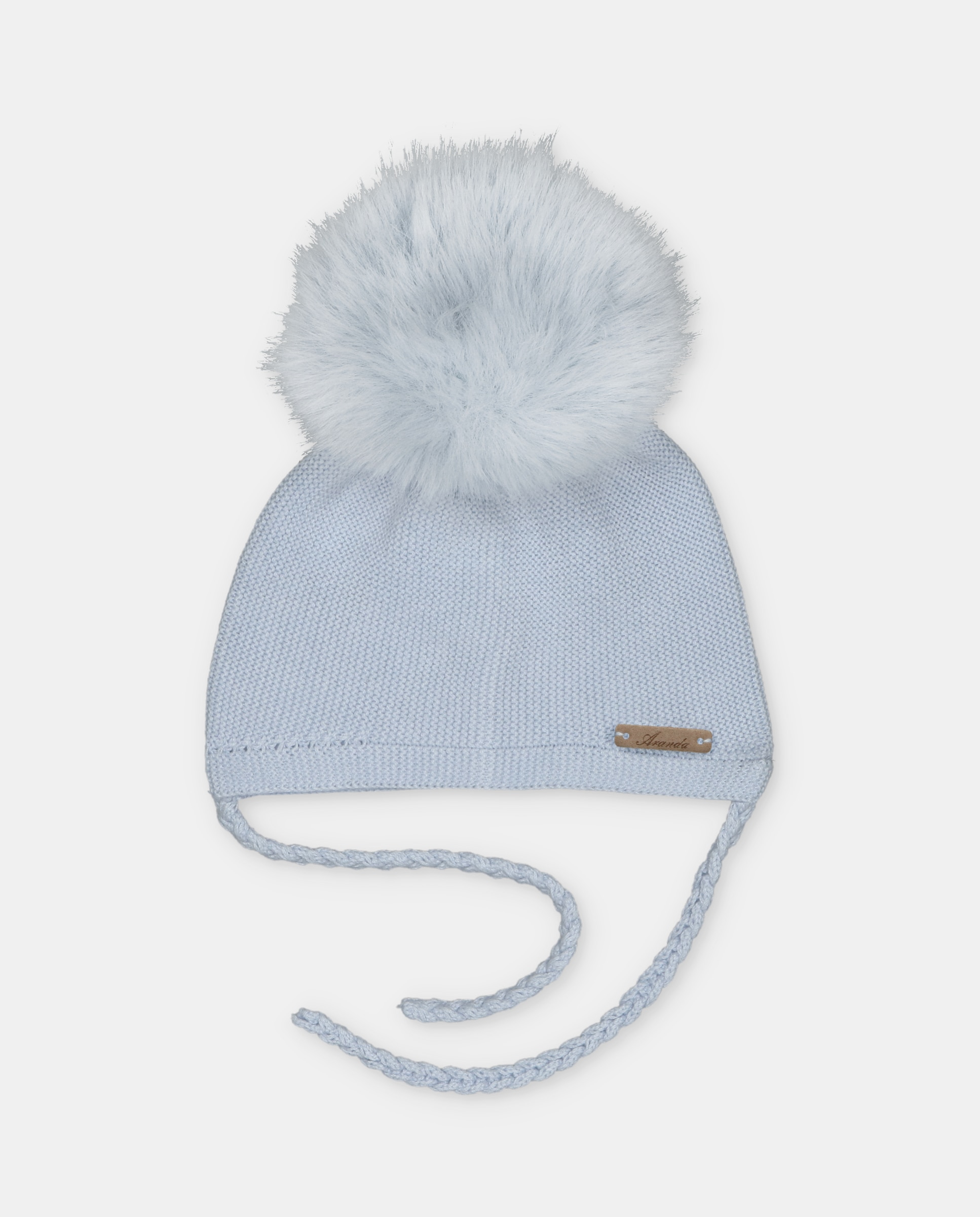 Gorro de bebés de punto con pompón de pelo y cierre de tiras trenzadas. - Martín Aranda - Azul celeste Azul celeste-1