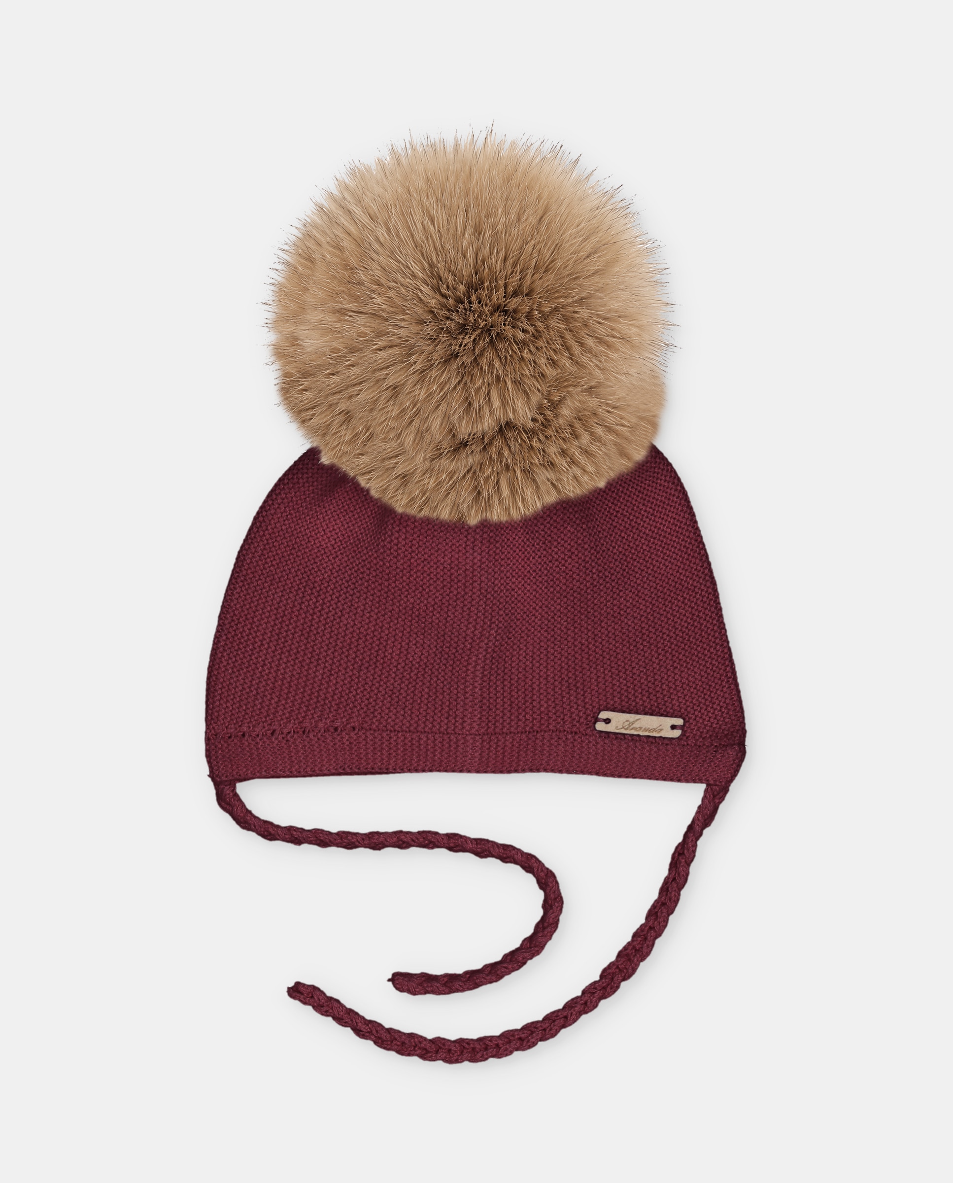Gorro de bebés de punto con pompón de pelo y cierre de tiras trenzadas. - Martín Aranda - Burdeos Burdeos-1