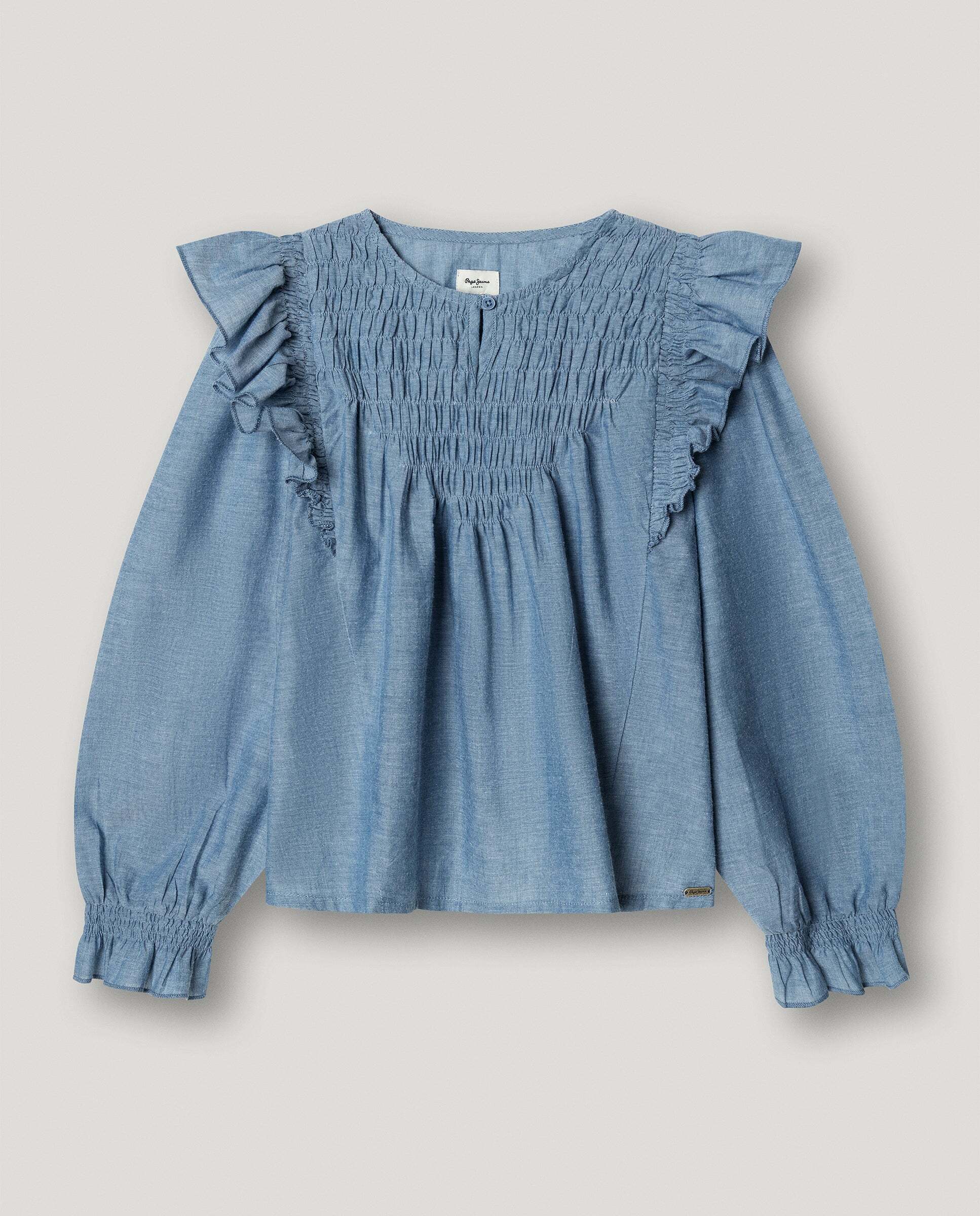 Imagen 0 de Blusa de niña chambray con volantes Azul